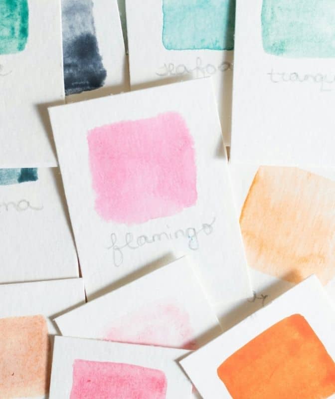 A collection of watercolor swatches labeled with names like "flamingo" showcases the vibrant hues that inspire brand evolution, adding creative flair to any brand design journey.